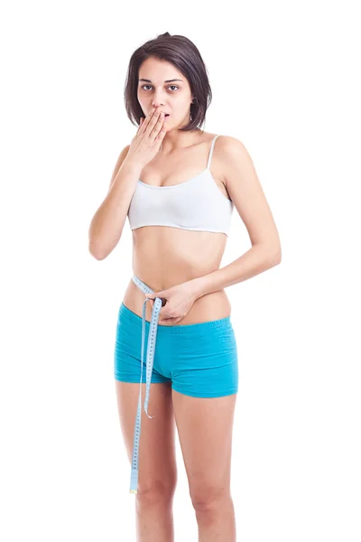 Jovem mulher magro medindo — Fotografia de Stock