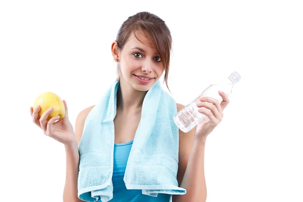 Woman holding bottle of water and apple — Stock Photo, Image