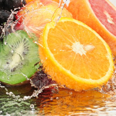 Pure fruit in a spray of water clipart