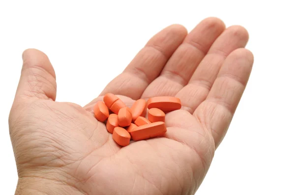 P-piller i en hand — Stockfoto