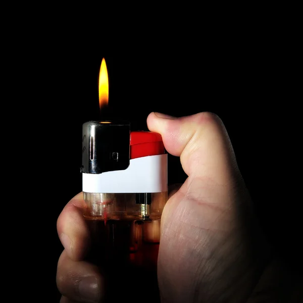 Lighter in hand — Stock Photo, Image
