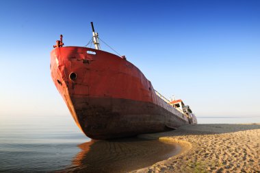 Fishing boat beached. clipart