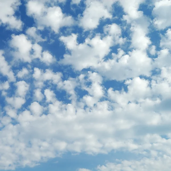 stock image White fluffy clouds in the blue sky