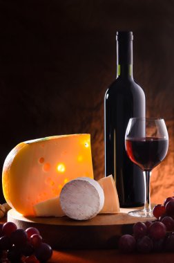 Still-life with cheese, grape and wine. clipart