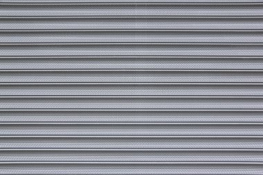 Perforated metal security shutter background clipart