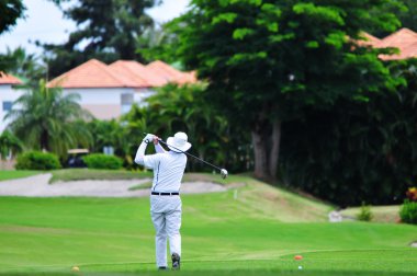 Man Playing Golf clipart