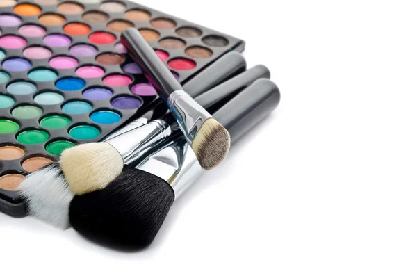 Více barevné make-up a štětce — Stock fotografie
