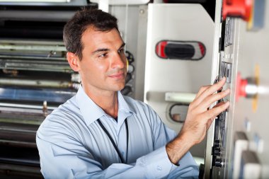 Technician setting industrial machine clipart