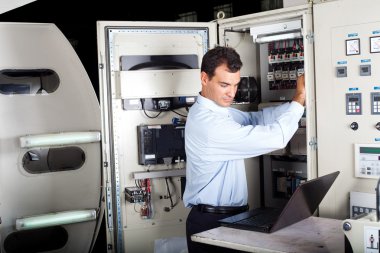 Technician repairing computerized machine clipart