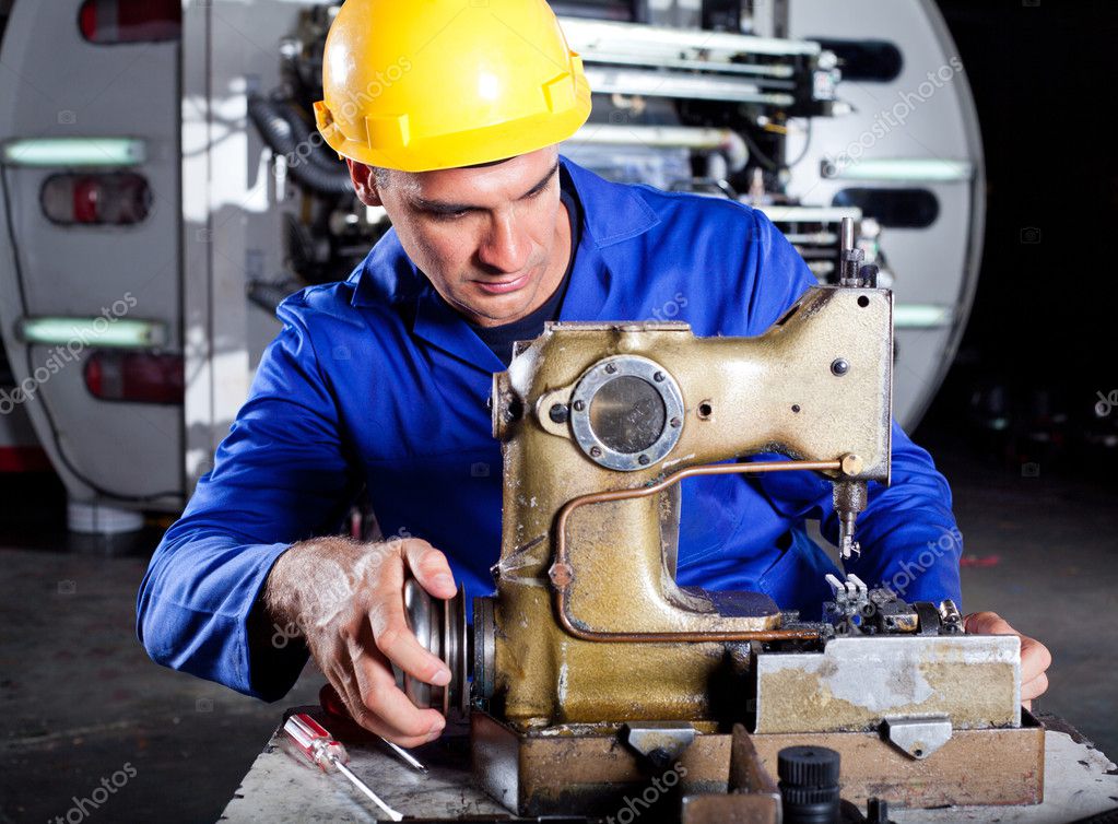 Technician fixing industrial sewing machine Stock Photo by ©michaeljung ...