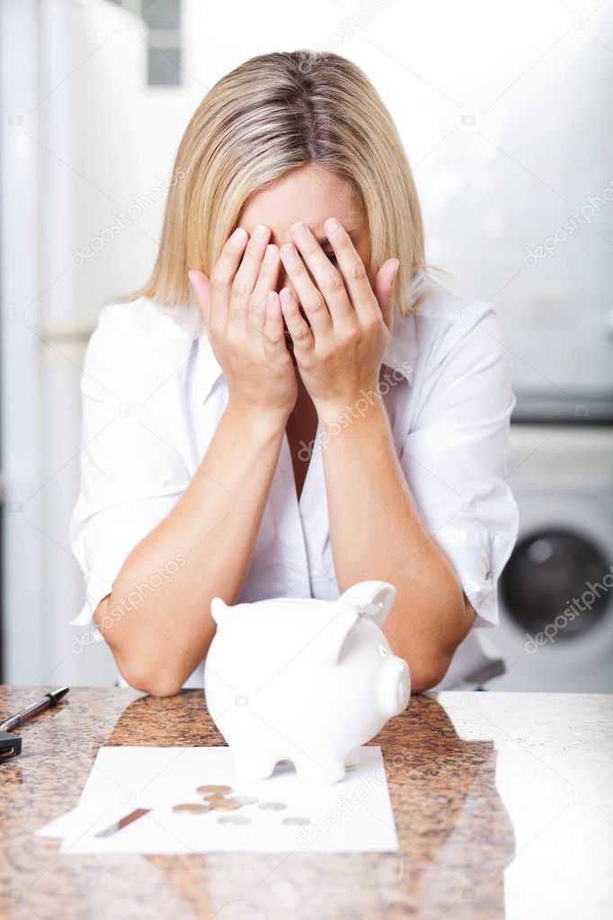 Unhappy young woman having financial trouble