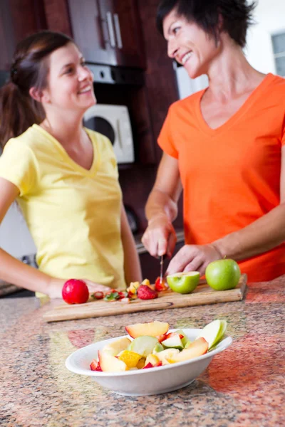 Happy mother and daughter cooking — Stock Photo, Image
