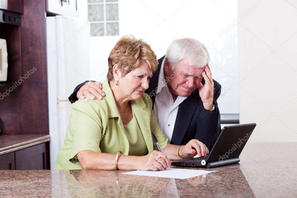 Senior couple worrying about money situation