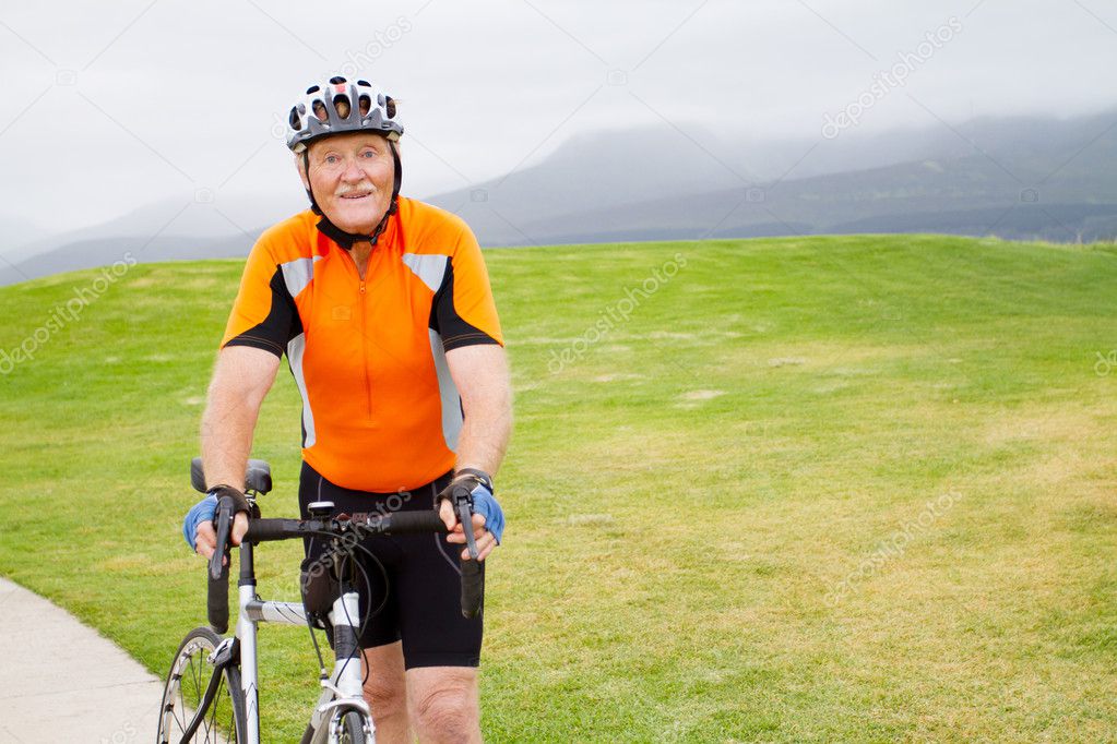 Senior male bicyclist outdoors