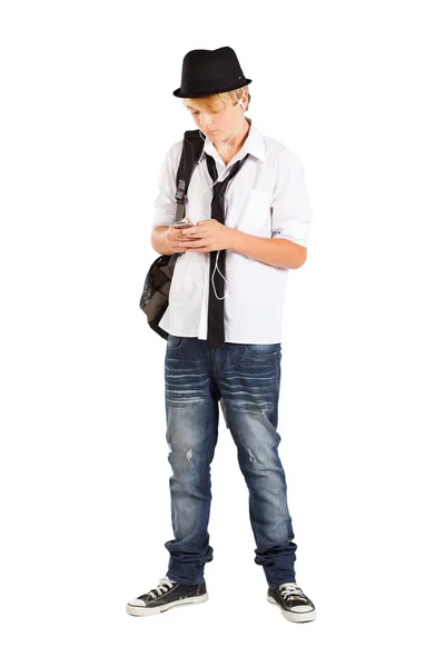 Teen pojke spela med mobiltelefon — Stockfoto