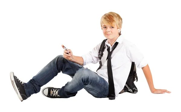 Tini fiú diák ül a földön — Stock Fotó