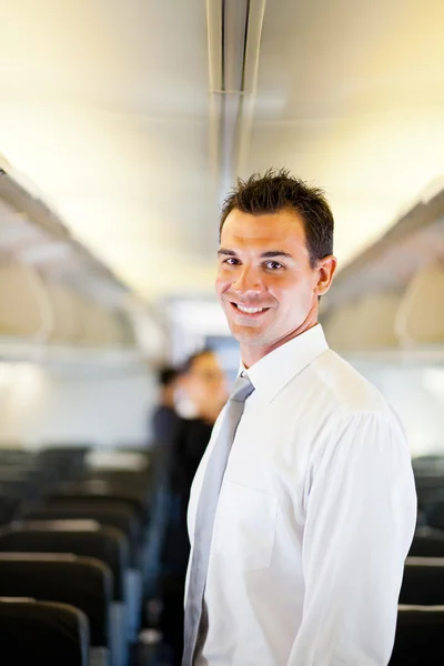 Businessman on airplane — Stock Photo, Image