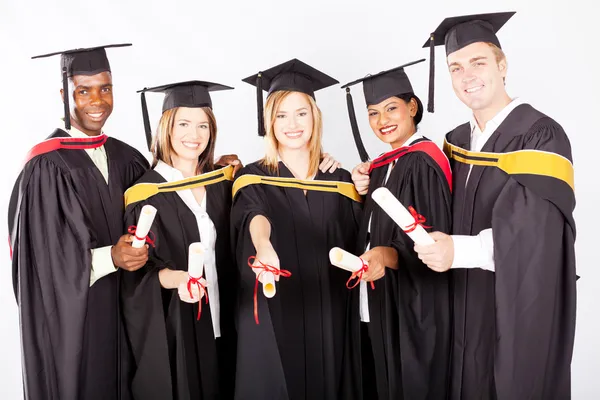 Group of graduates in graduation gown and cap — Stock Photo ...