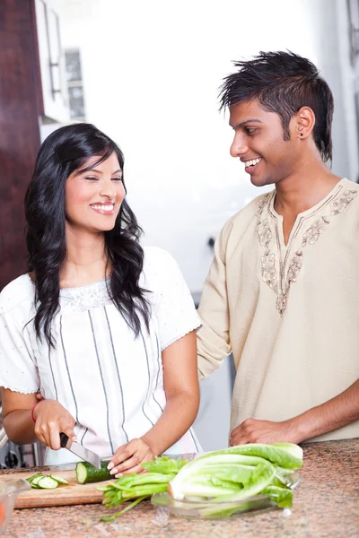 Happy indian couple cooking — Stock Photo, Image