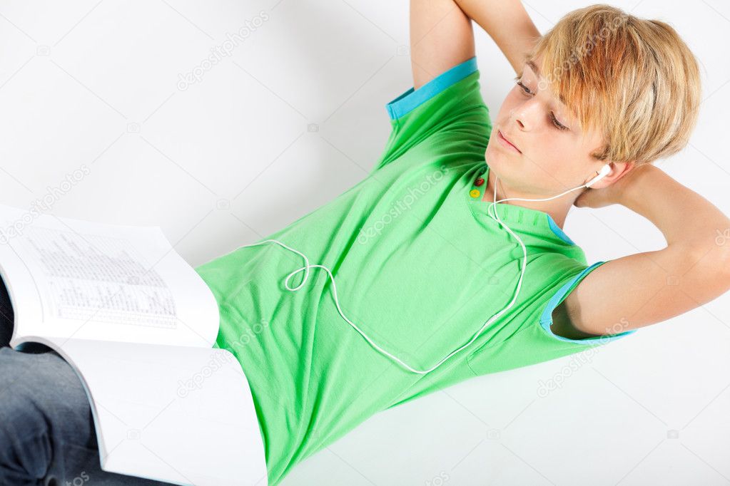 Teen boy reading book