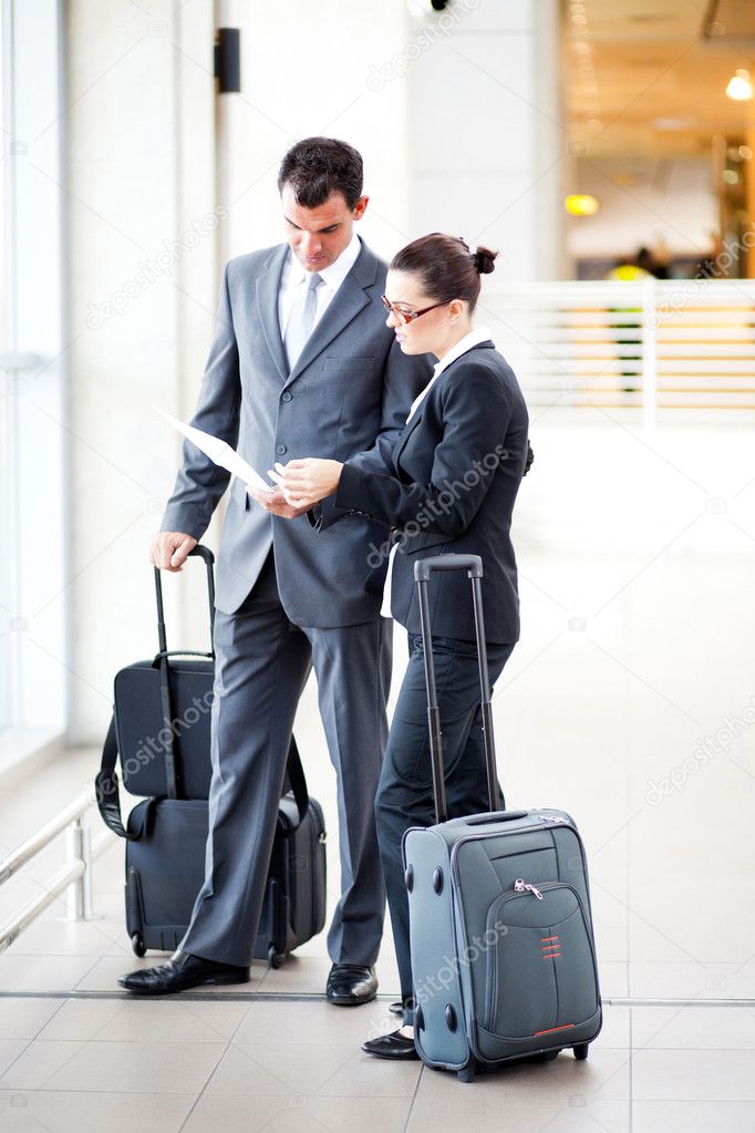 Businessman and businesswoman at airport