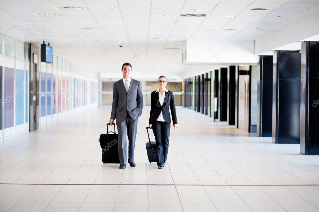 Business travellers walking in airport