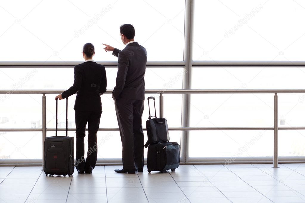 Silhouette of two businesspeople at airport
