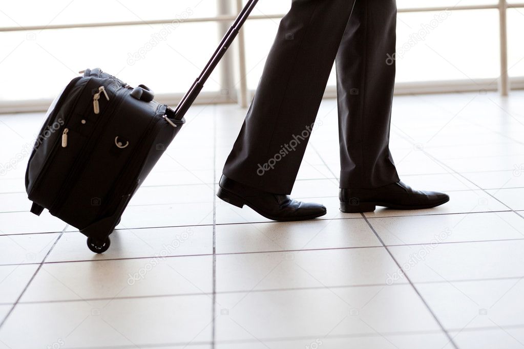 Silhouette of businessman walking in airport