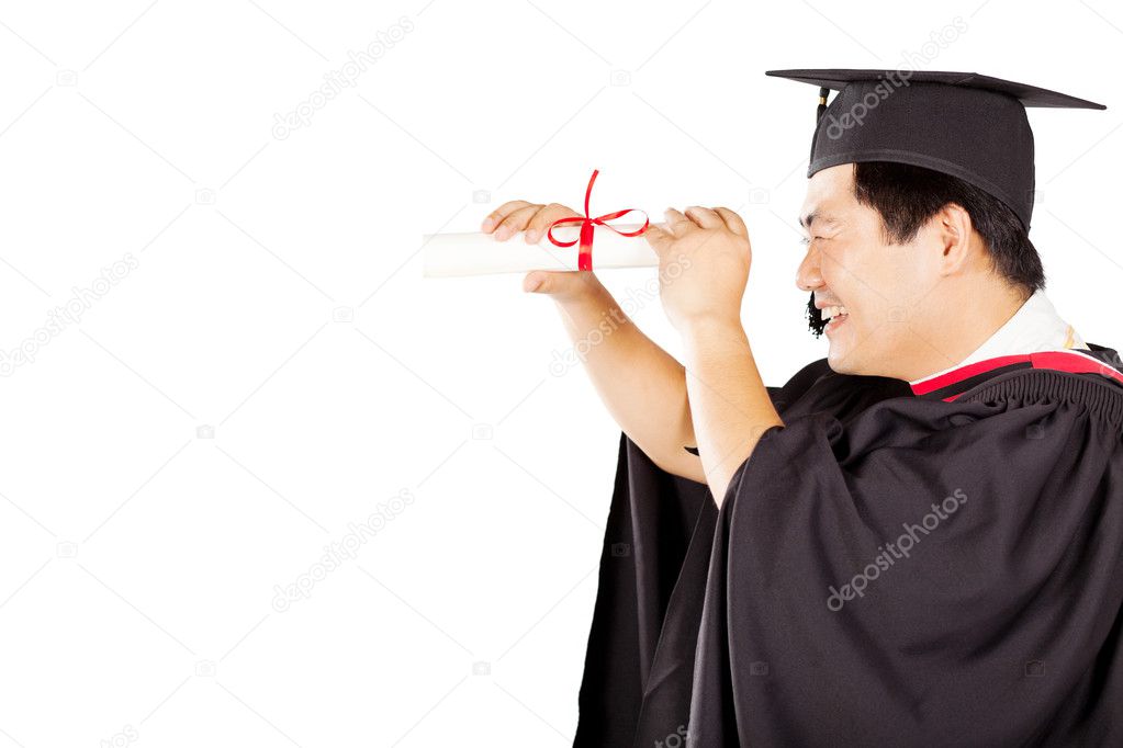 Male asian graduate looking through diploma