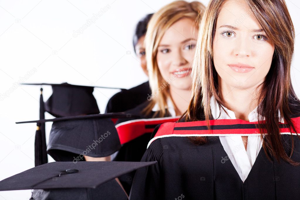 Graduates holding graduation caps