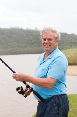 Senior man fishing clipart