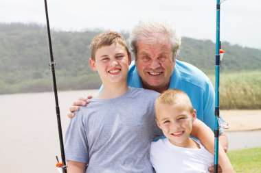 Grandpa and grandsons fishing clipart