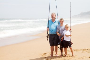 Family fishing on beach clipart