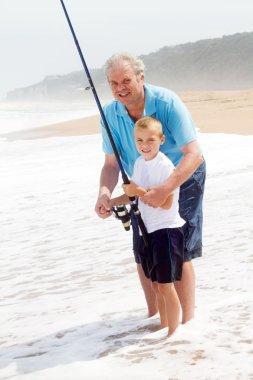 Grandpa teaching grandson fishing clipart