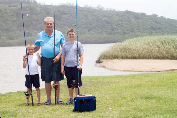 Grandfather and grandsons fishing — Stock Photo, Image