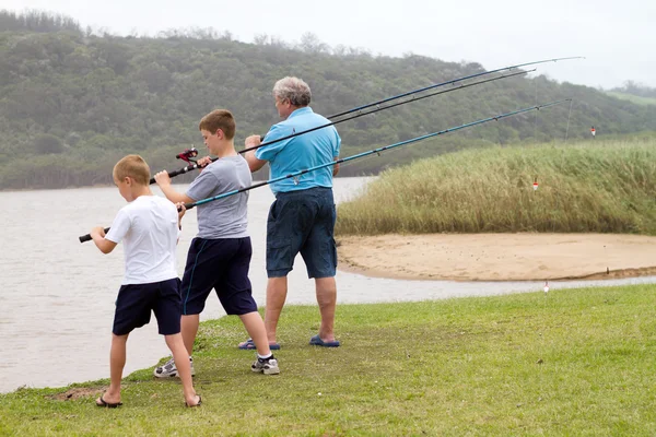 Grandsons fishing with grandpa — Stock Photo, Image