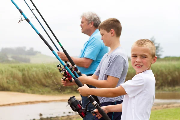 Grandsons fishing with grandpa — Stock Photo, Image