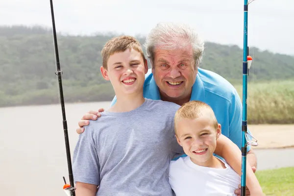 Grandpa and grandsons fishing — Stock Photo, Image