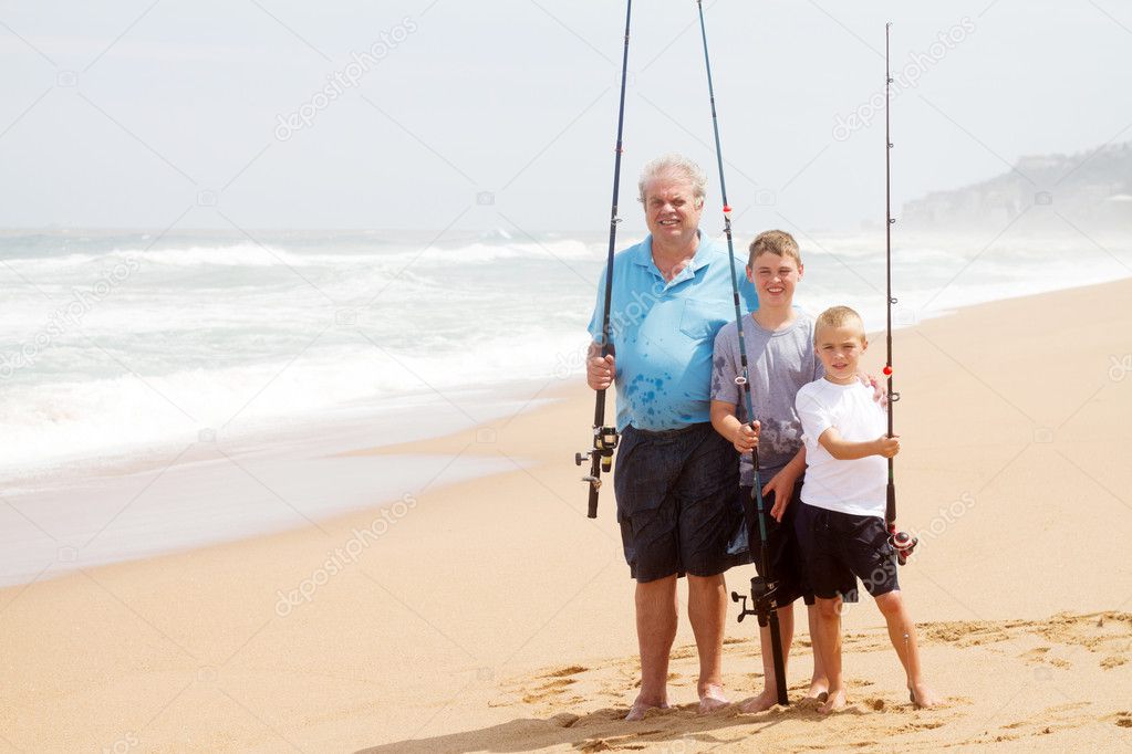 Family fishing on beach