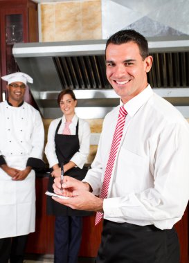 Young happy male restaurant manager clipart