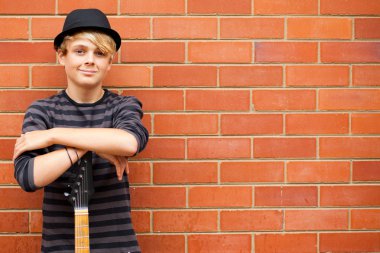 Teen boy with guitar clipart