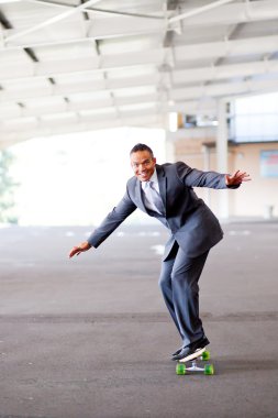 Businessman on skateboard clipart