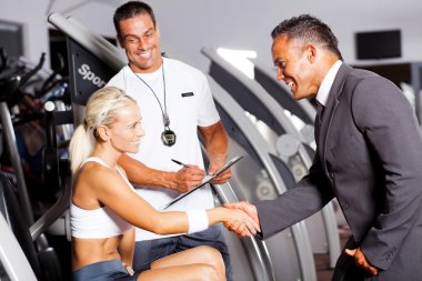 Gym manager greeting customer clipart