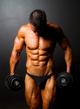 Bodybuilder with dumbbells clipart