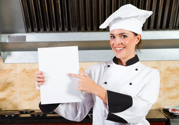 Chef femenino señalando menú —  Fotos de Stock