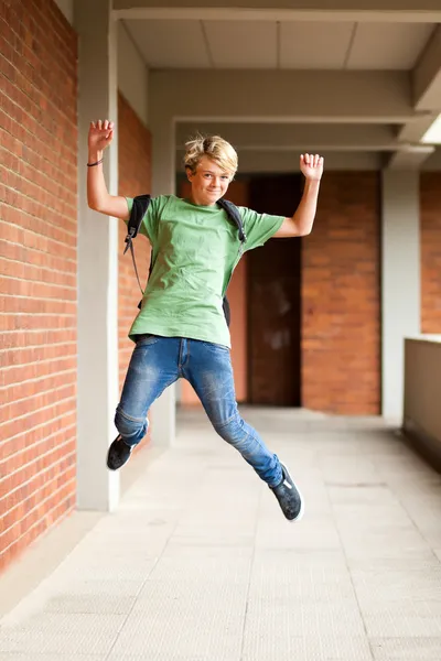 Happy high school student jumping up — Stock Photo, Image