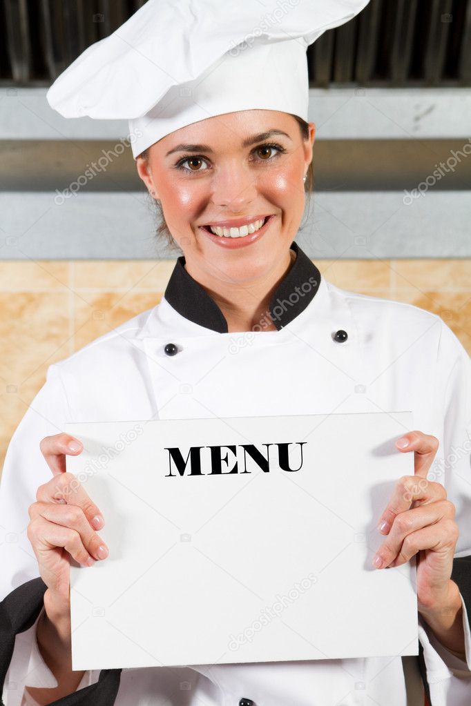 Female chef holding menu