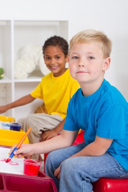 Kindergarten boys in classroom clipart