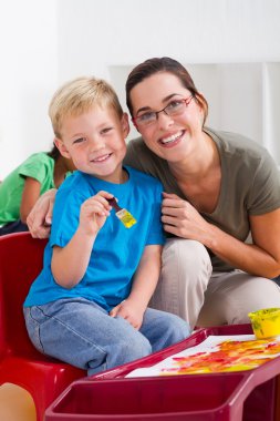 Happy preschool boy and teacher clipart