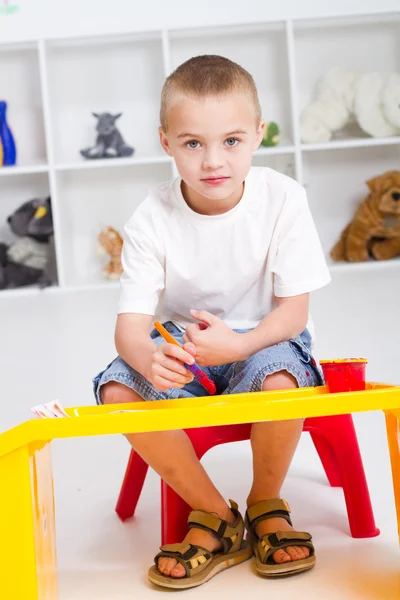 Preschool boy paint in classroom — Stock Photo, Image